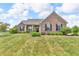 Charming single-story brick home featuring a well-manicured lawn and inviting front porch at 2948 Chalbury Dr, Plainfield, IN 46168