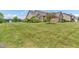 Spacious front yard with well-maintained lawn, landscaping, and a partial view of the home at 2948 Chalbury Dr, Plainfield, IN 46168