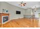 Spacious living room with hardwood floors, a cozy fireplace, and a flat screen television at 2948 Chalbury Dr, Plainfield, IN 46168