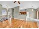 Bright living room features hardwood floors, fireplace, and a kitchen eating bar at 2948 Chalbury Dr, Plainfield, IN 46168