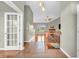 Inviting open-concept living space with hardwood floors, a cozy fireplace, and a staircase at 2948 Chalbury Dr, Plainfield, IN 46168