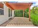 Cozy backyard patio with a pergola, offering a shaded retreat and access to the lush yard at 2948 Chalbury Dr, Plainfield, IN 46168