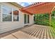 Back patio with pergola and a sliding glass door for backyard access and outdoor relaxation at 2948 Chalbury Dr, Plainfield, IN 46168