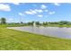 Scenic pond with a fountain, surrounded by a well-maintained grassy area at 2948 Chalbury Dr, Plainfield, IN 46168