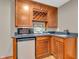 Close-up view of the wet bar with wine rack, microwave and stainless mini-refrigerator at 2948 Chalbury Dr, Plainfield, IN 46168