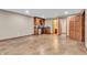 Basement wet bar featuring wood cabinetry, countertop space, and mini-refrigerator at 2948 Chalbury Dr, Plainfield, IN 46168