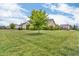 Expansive lawn with trees providing shade and landscaping, bordering neighboring houses at 2948 Chalbury Dr, Plainfield, IN 46168