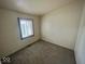 Neutral bedroom featuring soft carpet, natural light and a single window at 3161 Normandy Rd, Indianapolis, IN 46222