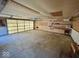 A spacious garage featuring concrete flooring, overhead lighting, and ample wall shelving at 3161 Normandy Rd, Indianapolis, IN 46222