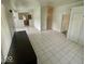 Open living room featuring neutral tile floors, and easy access to the kitchen at 3161 Normandy Rd, Indianapolis, IN 46222