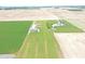 Expansive aerial view of property showcasing surrounding landscape, structures, and well-manicured grounds at 3301 N 200 W, Franklin, IN 46131