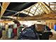 Unfinished attic space with exposed wooden beams, storage items, and evidence of recent work at 3301 N 200 W, Franklin, IN 46131