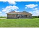 Home with green lawn, a brick exterior, and views of agricultural fields at 3301 N 200 W, Franklin, IN 46131
