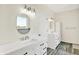 A bathroom with double sinks, vanity and mirror, storage, and modern lighting fixtures at 3301 N 200 W, Franklin, IN 46131