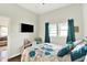 Cozy bedroom with a TV and a connecting room in the background at 3301 N 200 W, Franklin, IN 46131