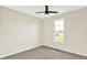 Carpeted bedroom featuring a ceiling fan and a window that offers exterior views at 3301 N 200 W, Franklin, IN 46131