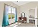 Bright bedroom featuring a vanity, carpeted floors, and natural light from the large window at 3301 N 200 W, Franklin, IN 46131