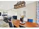 Open floor plan with view from dining area to living room and kitchen with island seating at 3301 N 200 W, Franklin, IN 46131