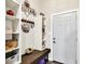 Welcoming entryway with storage shelves, coat hooks, and a rustic wooden bench at 3301 N 200 W, Franklin, IN 46131