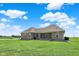 Brick home featuring a green lawn, a level yard, and gravel landscaping at 3301 N 200 W, Franklin, IN 46131