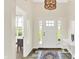 Bright foyer with a white door, elegant light fixture, and a view to the outside at 3301 N 200 W, Franklin, IN 46131