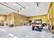 Spacious garage with a high ceiling, concrete floor, and ample room for vehicles and equipment at 3301 N 200 W, Franklin, IN 46131