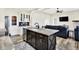 Open kitchen design with a large center island, barstool seating, and seamless flow into the living room at 3301 N 200 W, Franklin, IN 46131