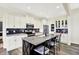 Spacious kitchen features white cabinets, granite countertops, stainless steel appliances, and a large center island at 3301 N 200 W, Franklin, IN 46131