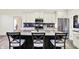Gorgeous island kitchen boasts granite countertops, stainless appliances, and sleek black backsplash at 3301 N 200 W, Franklin, IN 46131