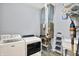Well-equipped laundry room with washer, dryer, furnace, utility sink, and shelving at 3301 N 200 W, Franklin, IN 46131