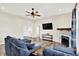Spacious living room with wood-look floors, fireplace, large sectional sofa and lots of natural light at 3301 N 200 W, Franklin, IN 46131