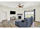 Comfortable living room with fireplace, TV and large window offering plenty of natural light at 3301 N 200 W, Franklin, IN 46131