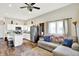 Open living room and kitchen area with stainless steel appliances, island, and modern decor at 3301 N 200 W, Franklin, IN 46131