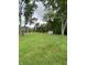 Expansive backyard with mature trees and a charming shed, offering a serene and private outdoor space at 386 Shadow Hill Dr, Greenwood, IN 46142