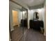Well-lit bathroom with dark vanities, decorative mirrors, and contemporary tile flooring at 386 Shadow Hill Dr, Greenwood, IN 46142
