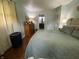 Bright bedroom with a well-maintained bed, complemented by lots of storage, and an ensuite bathroom at 386 Shadow Hill Dr, Greenwood, IN 46142