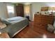 Comfortable bedroom featuring a plush bed, hardwood floors, and ample closet space at 386 Shadow Hill Dr, Greenwood, IN 46142