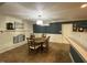 Cozy dining room with wood table set, brick fireplace, and unique lighting fixture at 386 Shadow Hill Dr, Greenwood, IN 46142