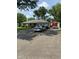 Ranch home featuring a long driveway with multiple parked vehicles and a detached garage at 386 Shadow Hill Dr, Greenwood, IN 46142