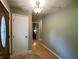 Inviting entryway features a decorative front door with glass insert, light-colored walls and durable laminate flooring at 386 Shadow Hill Dr, Greenwood, IN 46142
