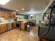 Bright kitchen open to dining area, featuring stainless steel appliances, wood cabinets and ample counter space at 386 Shadow Hill Dr, Greenwood, IN 46142