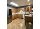 Well-equipped kitchen with stainless steel appliances, wood cabinetry, and ample counter space for meal preparation at 386 Shadow Hill Dr, Greenwood, IN 46142