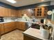 Well-equipped kitchen with stainless steel appliances, wood cabinetry, and ample counter space for meal preparation at 386 Shadow Hill Dr, Greenwood, IN 46142