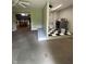 Open floor plan featuring a laundry area with modern appliances and checkered flooring, offering convenience and style at 386 Shadow Hill Dr, Greenwood, IN 46142