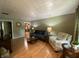 Bright living room features wood floors, large windows, and stylish furnishings, creating a cozy and inviting atmosphere at 386 Shadow Hill Dr, Greenwood, IN 46142