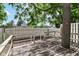 Backyard deck featuring aged wood and natural tree trunk element at 392 Aspen Dr, Carmel, IN 46032