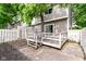 Back deck showing stairs leading up from a concrete patio and access to the sliding glass door at 392 Aspen Dr, Carmel, IN 46032