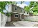 The backyard features a large concrete patio, a privacy fence, and a green lawn space at 392 Aspen Dr, Carmel, IN 46032