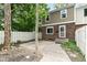 View of the townhome backyard and brick exterior at 392 Aspen Dr, Carmel, IN 46032