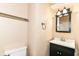 This bathroom boasts a modern black vanity, sleek mirror, and convenient towel racks at 392 Aspen Dr, Carmel, IN 46032